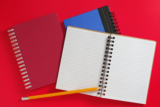 Open Spiral Notebook and Pencil