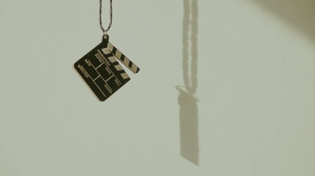 Film clapperboard hanging on wall