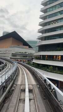 Monorail track passing modern buildings in Tokyo