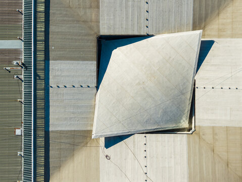 Aerial view of the geometric roof structure of a modern building with sharp angles and clean lines in Novi Sad, Vojvodina, Serbia.