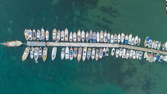 Aerial Top-Down View of Boats Moored at Marina Pier