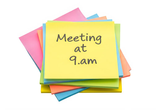 Stack of colorful sticky notes with meeting reminder, a stack of colorful