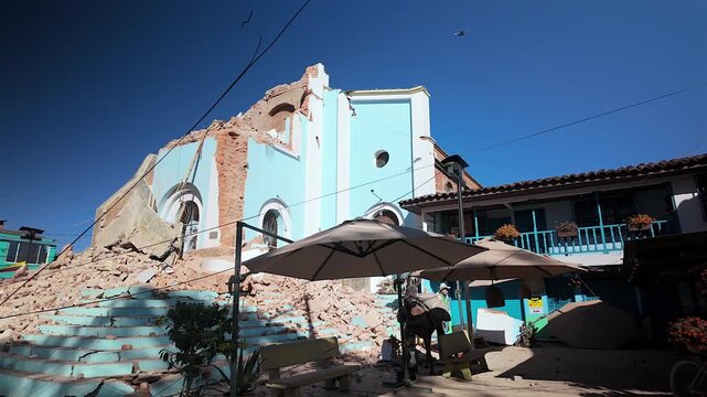 colombia earthquake damage with collapsed church and rubble on street