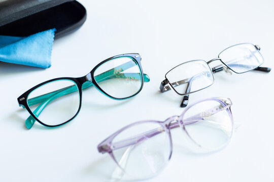 Glasses for vision on a white background in optical store. Vision test concept, stylish glasses concept