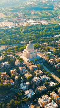 Vertical video. Rome, Italy. Basilica dei Santi Pietro e Paolo. District EUR - Quarter is a vast complex of buildings built on the orders of dictator Benito Mussolini. Drone footage, Point of interes