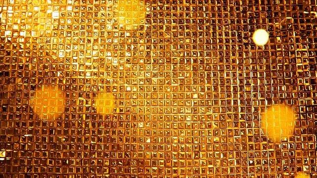 Golden textured surface with bokeh lights