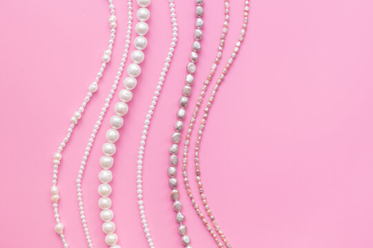 Precious pearls necklace beads for jewelry, top view. Different shapes pearls. Beauty and elegance concept background