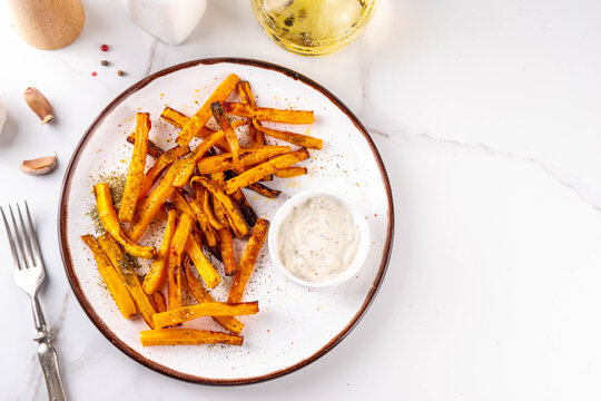 Tasty Air Fried Carrot or Pumpkin Fries. Homemade french fries made with Carrot or Pumpkin wedges, healthy vegan diet food idea