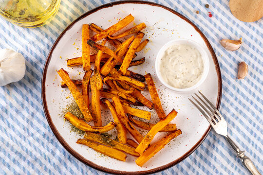 Tasty Air Fried Carrot or Pumpkin Fries. Homemade french fries made with Carrot or Pumpkin wedges, healthy vegan diet food idea