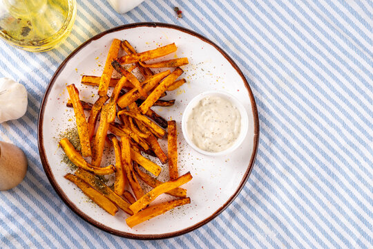 Tasty Air Fried Carrot or Pumpkin Fries. Homemade french fries made with Carrot or Pumpkin wedges, healthy vegan diet food idea
