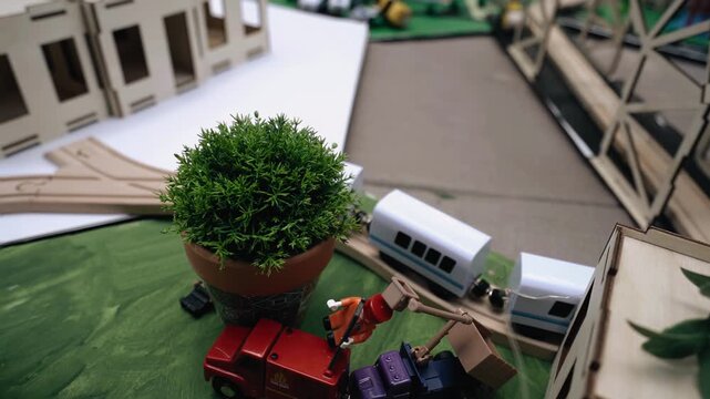 A close-up of a toy train that rides on rails in a toy city