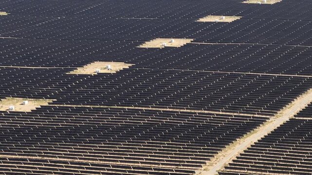 Aerial View of Utility-Scale Solar Farm with Battery Energy Storage System in Arid Desert