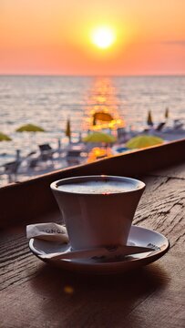 Cappuccino Coffee during sunset in a beach bar in Montenegro