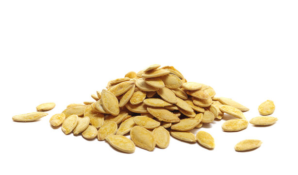 Pile roasted pumpkin seeds with salt isolated on white