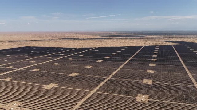 Aerial View of Utility-Scale Solar Farm with Battery Energy Storage System in Arid Desert