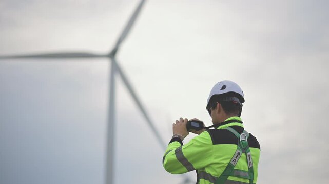 Engineers working on site in wind turbine farm, Wind turbines generate clean energy source, Eco technology for electric, industry environment, sustainable technology wind power maintenance.