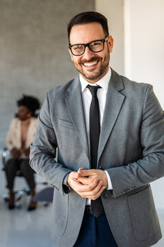 Successful lawyer in business suit smiling confidently, representing legal advice, law expertise