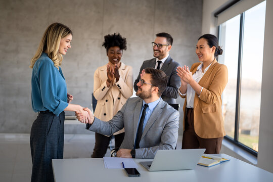 Happy office staff, success employee giving hand for shaking. Business people offering handshake