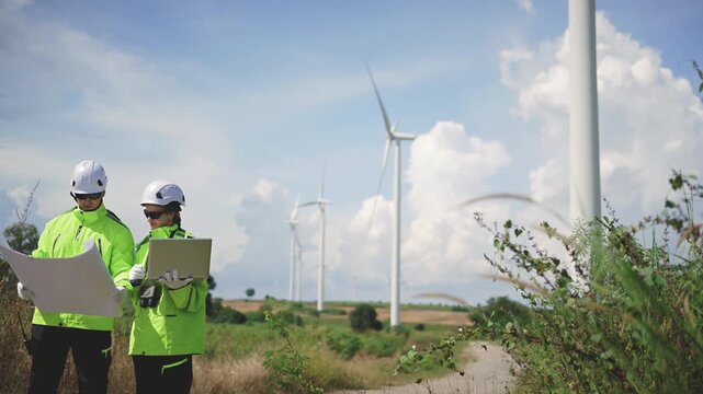Engineers working on site in wind turbine farm, Wind turbines generate clean energy source, Eco technology for electric, industry environment, sustainable technology wind power maintenance.