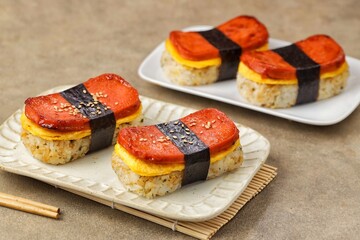 Classic Hawaiian spam musubi, made with grilled spam, seasoned rice, and wrapped with nori seaweed © Noor