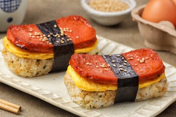 Classic Hawaiian spam musubi, made with grilled spam, seasoned rice, and wrapped with nori seaweed © Noor