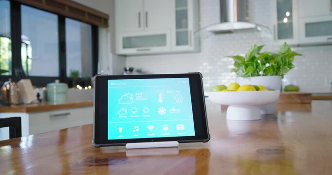 Moving camera is shifting focus and exposure to showcase tablet dashboard on kitchen countertop