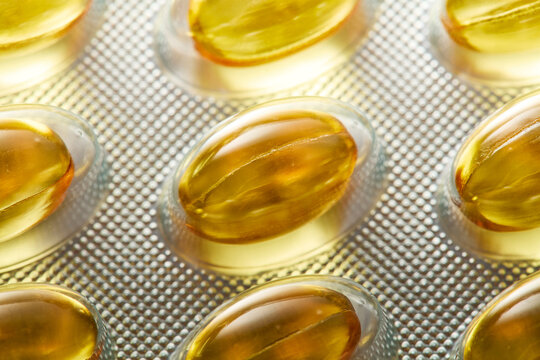Close-Up of Yellow Softgel Capsules in Blister Pack