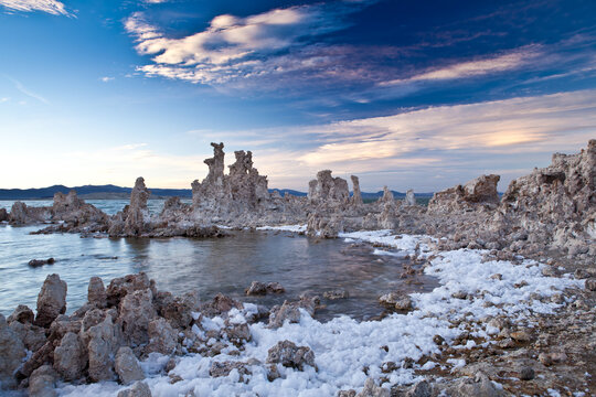 Dramatic tufa towers rock formations at Mono Lake under a beautiful sunset sky

