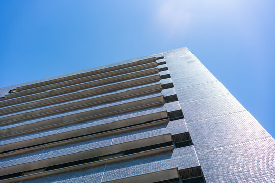 Modern Architecture Office Building Facade with Minimalist Lines for Corporate Real Estate Investment and Urban Business Development, Low Angle Perspective Photo with Copyspace