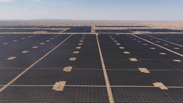 Aerial View of Utility-Scale Solar Farm with Battery Energy Storage System in Arid Desert