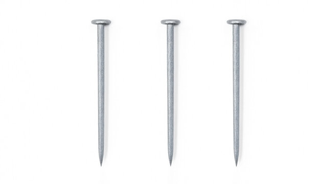 Three shiny metal construction nails arranged in a row