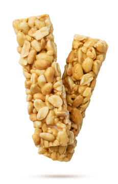 Peanut caramel bars flying on a white. Isolated