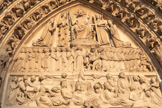 Notre-Dame de Paris, Entrance: Illustration of the Last Judgement, central portal of west facade. Archangel Michael and Satan weighing souls