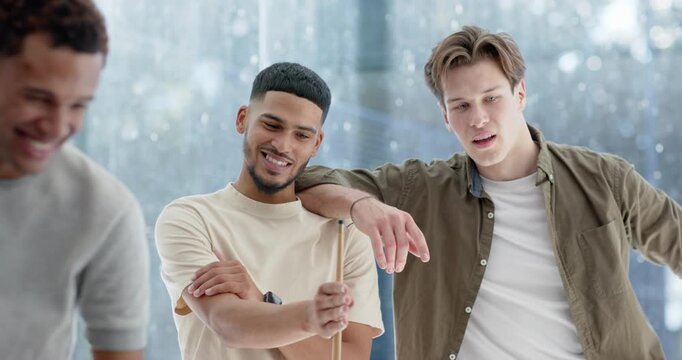 Diverse male friends leaning on cues, laughing sparking shooter lining up cue playing billiards