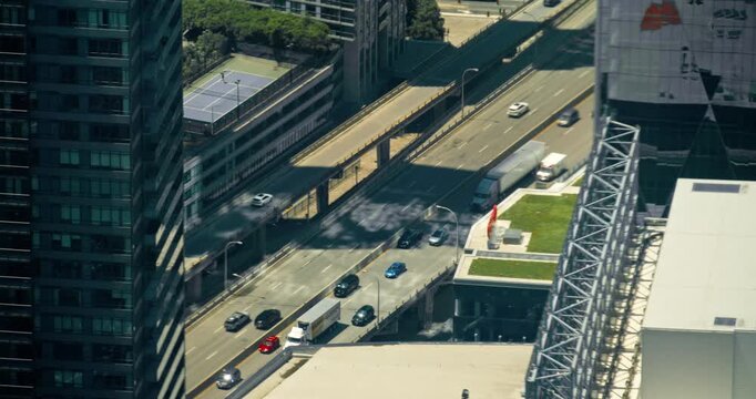 Traffic flows through downtown Toronto during a clear day in the afternoon