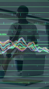 Animation of financial data processing over diverse colleagues discussing work in office