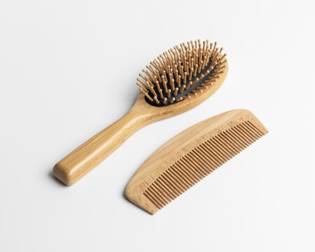 Eco friendly bamboo hairbrush and wooden comb mockup on white background