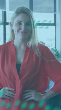 Animation of financial data processing over caucasian businesswoman in office