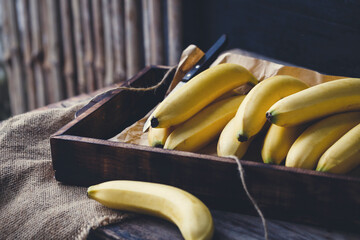 Fresh bananas on the dark background © Thai