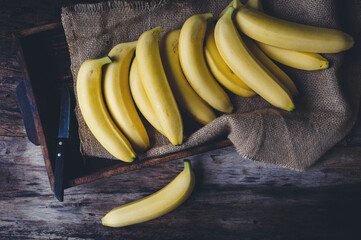 Fresh bananas on the dark background © Thai