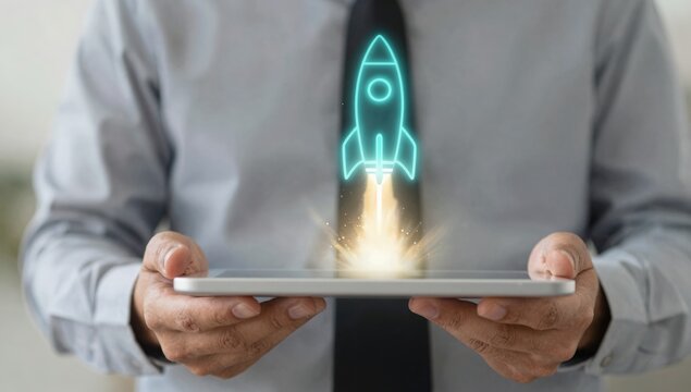 Startup rocket launch hologram rising from tablet in businessman hands, symbolizing business growth, innovation strategy, digital transformation, project success and technology development concept.