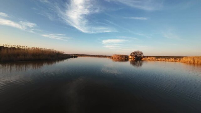 Calm waters of a river at sunset