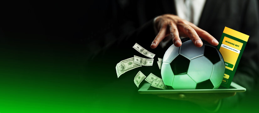 Sport bet on soccer with cash and betting ticket on a tray during an event