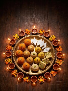 Traditional Sweets and Diya Thali Arrangement for Diwali Social Media Marketing Background