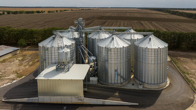 Aerial view of agricultural Silos. Storage and drying of grains, wheat, corn, soy, sunflower. Elevator silos