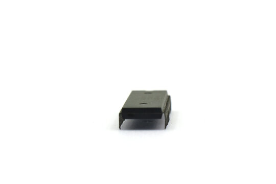 A blurry microcontroller on a white background. An archaic concept of technological advancement.