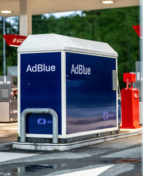 Lindesnes, Norway - June 12 2026: Blue AdBlue service container at fuel station forecourt.