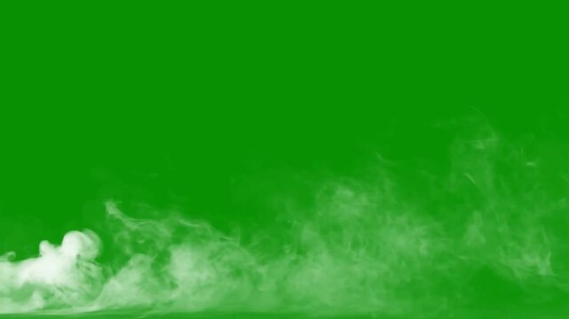 Realistic white smoke drifting on chroma key green screen background overlay element