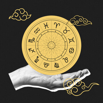 Hand holding a zodiac wheel with astrological symbols and clouds in a dark background