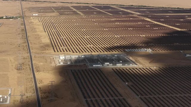 Aerial View of Utility-Scale Solar Farm with Battery Energy Storage System in Arid Desert